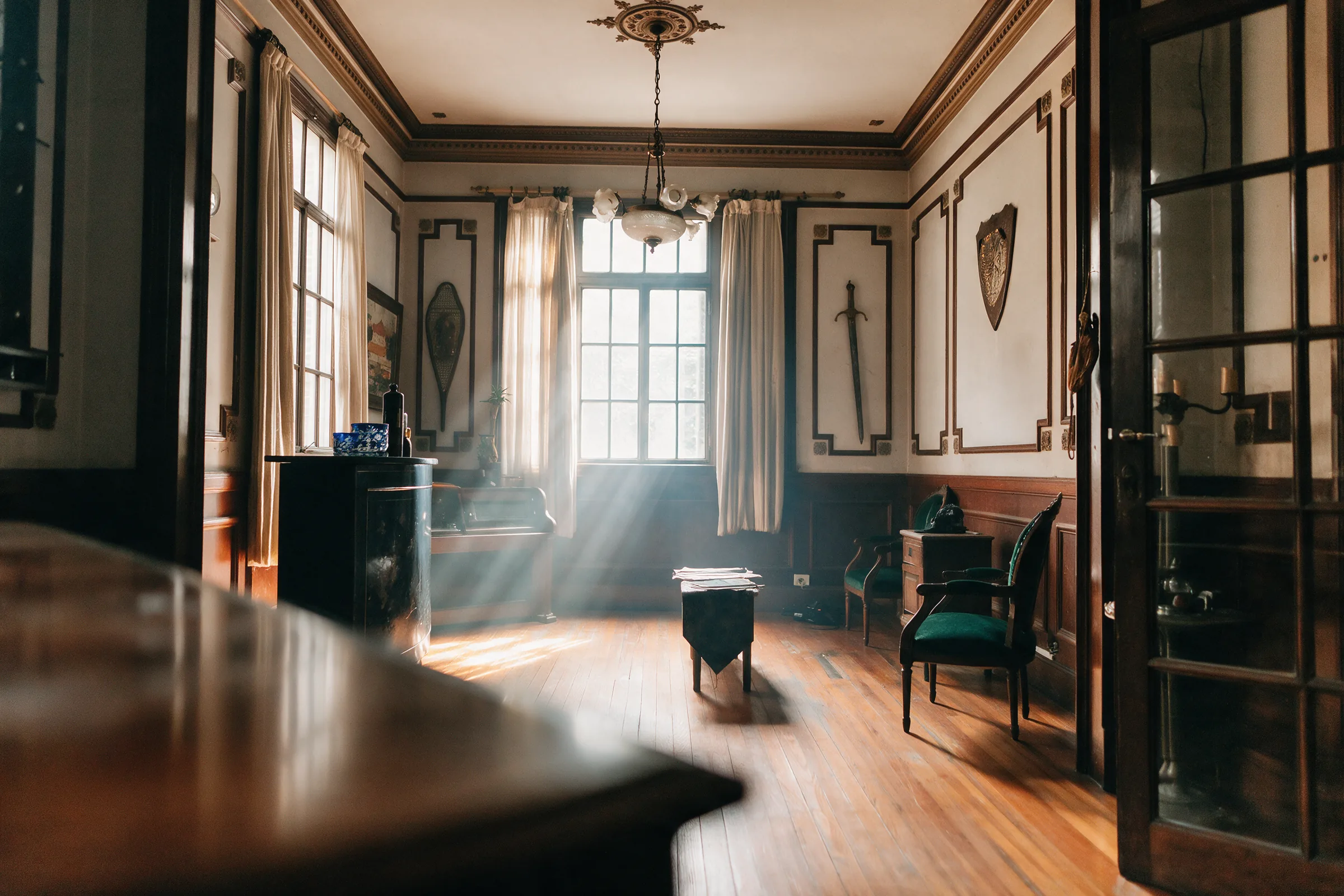 Sunlit parlor before and after real estate photo enhancement edited