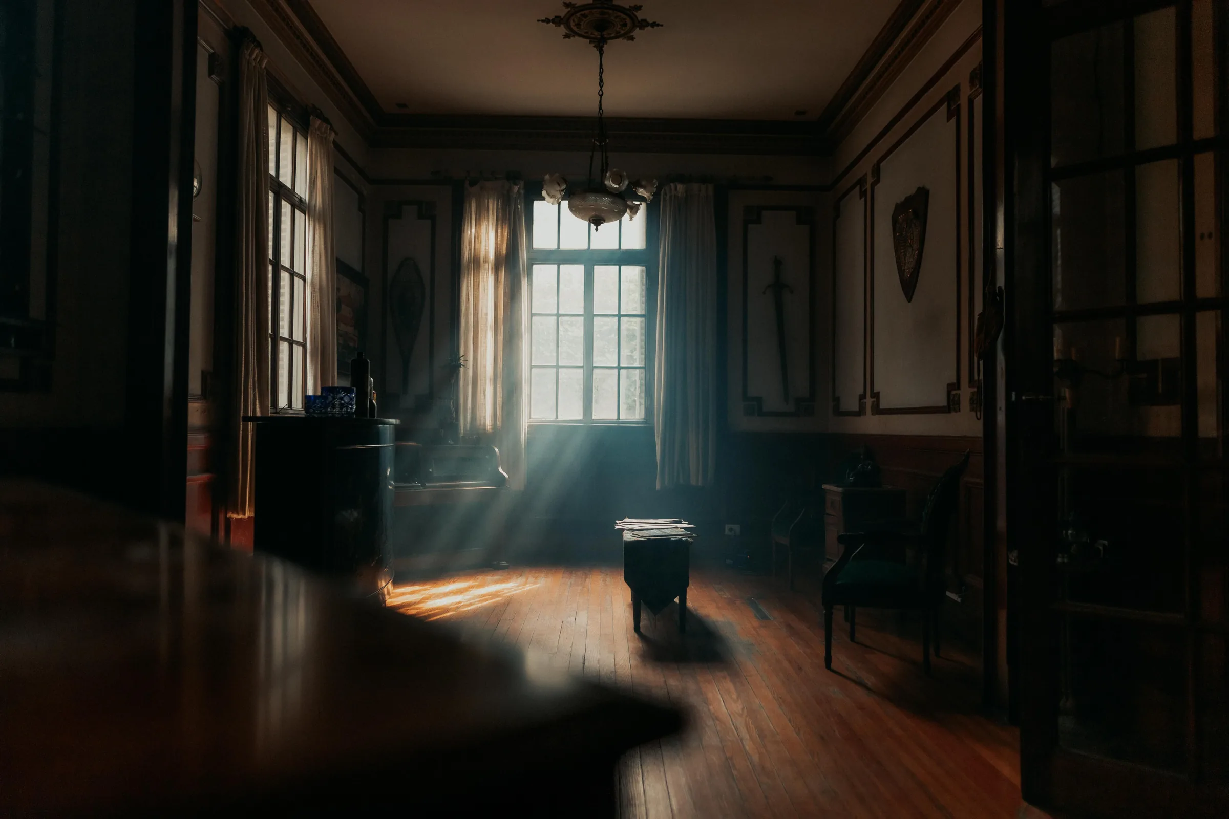 Sunlit parlor before and after real estate photo enhancement original